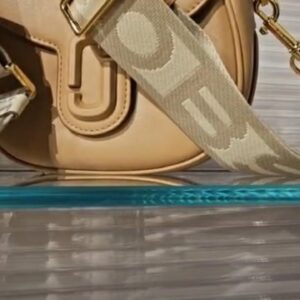 (INTERNAL USE ONLY) LD JUNE 1 MJ RETAIL J MARC SADDLE FLAP XBODY BAG COFFEE